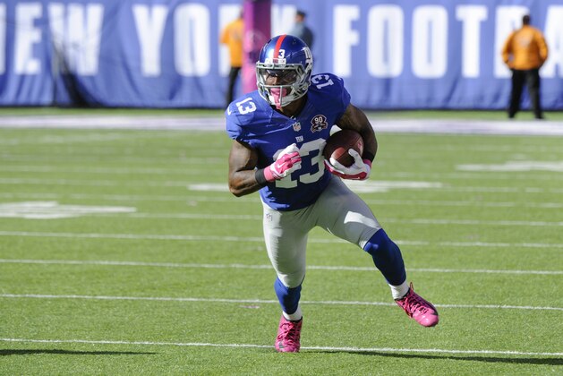 New York Giants wide receiver Odell Beckham runs with the ball against the Atlanta Falcons during the second half of an NFL football game, Sunday, Oct. 5, 2014, in East Rutherford, N.J. (AP Photo/Bill Kostroun)
