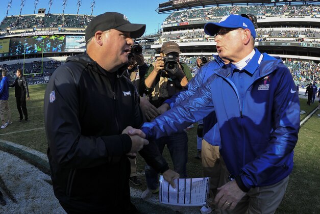 Oct 27, 2013; Philadelphia, PA, USA; New York Giants head coach Tom Coughlin (right) and Philadelphia Eagles head coach Chip Kelly (left) shake hands after the second half at Lincoln Financial Field. The Giants won the game 15-7. Mandatory Credit: Joe Camporeale-USA TODAY Sports