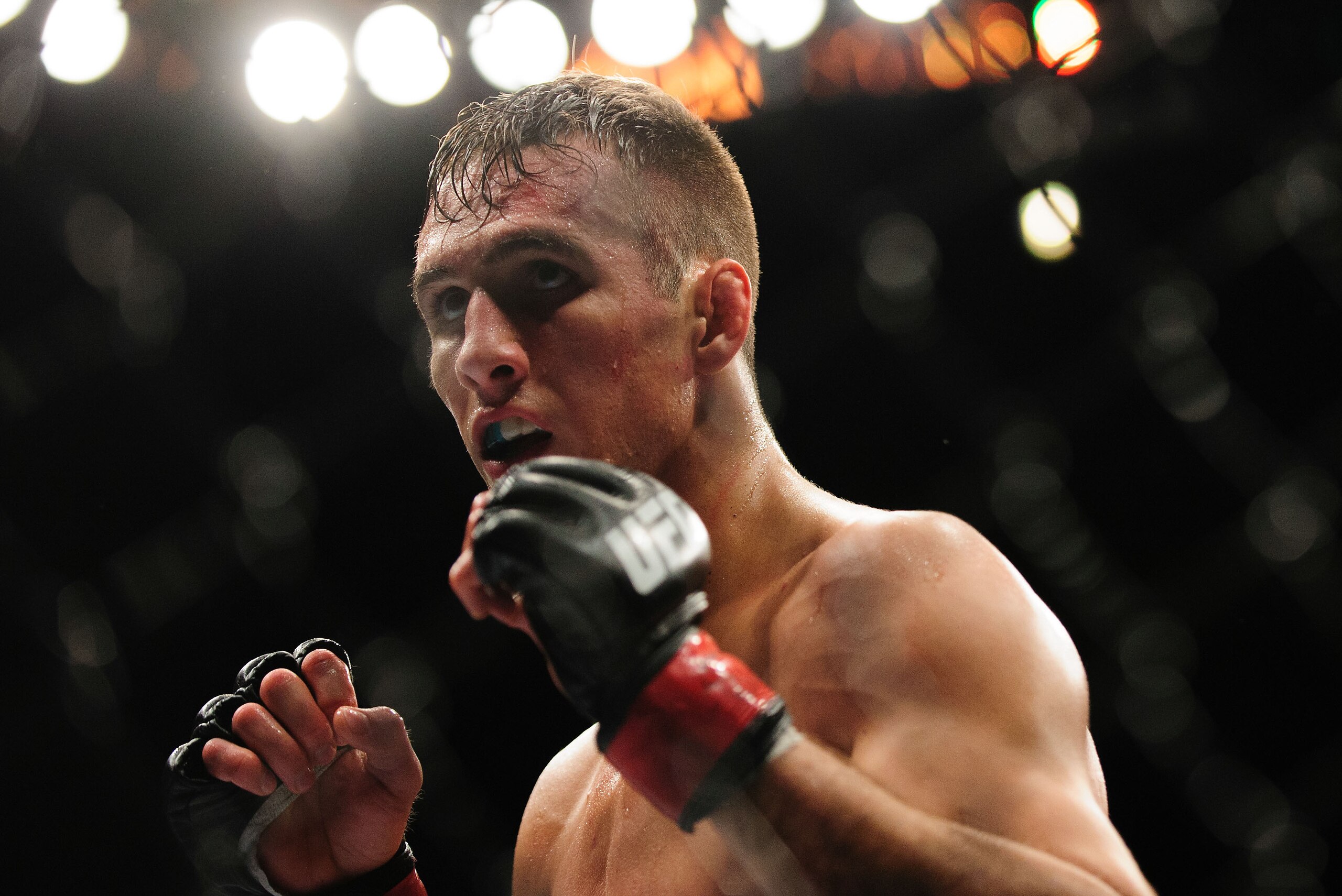 Jun 14, 2014; Vancouver, British Columbia, Canada; Rory MacDonald (red) fights Tyron Woodley (blue) during the Welterweigtht bout at UFC 174 at Rogers Arena. Rory MacDonald defeats Tyron Woodley  via unanimous decision. Mandatory Credit: Anne-Marie Sorvin-USA TODAY Sports