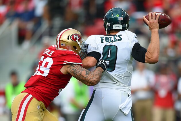 SANTA CLARA, CA - SEPTEMBER 28:  Nick Foles #9 of the Philadelphia Eagles is pressured by Aaron Lynch #59 of the San Francisco 49ers during the fourth quarter at Levi's Stadium on September 28, 2014 in Santa Clara, California.  (Photo by Thearon W. Henderson/Getty Images)
