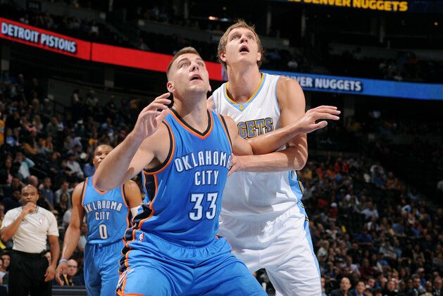DENVER, CO - October 8: Mitch McGary #33 of the Oklahoma City Thunder battles for position against Timofey Mozgov #25 of the Denver Nuggets on October 8, 2014 at the Pepsi Center in Denver, Colorado. NOTE TO USER: User expressly acknowledges and agrees that, by downloading and/or using this Photograph, user is consenting to the terms and conditions of the Getty Images License Agreement. Mandatory Copyright Notice: Copyright 2014 NBAE (Photo by Bart Young/NBAE via Getty Images)