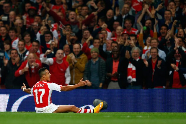 LONDON, ENGLAND - SEPTEMBER 23:  Alexis Sanchez of Arsenal celebrates scoring a free kick to make it 1-0 during the Capital One Cup Third Round match between Arsenal and Southampton at the Emirates Stadium on September 23, 2014 in London, England.  (Photo by Julian Finney/Getty Images)