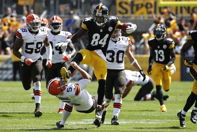 Pittsburgh Steelers Antonio Brown (84) kicks Cleveland Browns punter Spencer Lanning (5) as he jumps while returning a punt in the second quarter of the NFL football game on Sunday, Sept. 7, 2014 in Pittsburgh. Brown was penalized for unnecessary roughness on the play. (AP Photo/Gene J. Puskar)