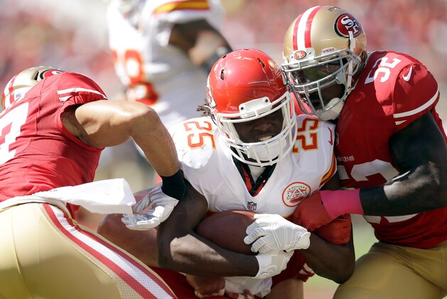 SANTA CLARA, CA - OCTOBER 05:  Jamaal Charles #25 of the Kansas City Chiefs is tackled by Patrick Willis #52 of the San Francisco 49ers at Levi's Stadium on October 5, 2014 in Santa Clara, California.  (Photo by Ezra Shaw/Getty Images)