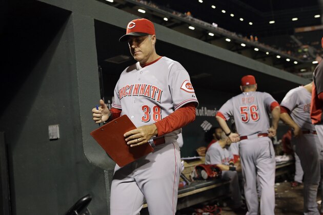Cincinnati Reds manager Bryan Price walks in the dugout during an interleague baseball game against the Baltimore Orioles, Wednesday, Sept. 3, 2014, in Baltimore. (AP Photo/Patrick Semansky)