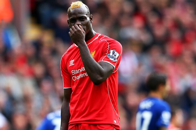 LIVERPOOL, ENGLAND - SEPTEMBER 27:  Mario Balotelli of Liverpool reacts after a missed chance of goal during the Barclays Premier League match between Liverpool and Everton at Anfield on September 27, 2014 in Liverpool, England.  (Photo by Alex Livesey/Getty Images)