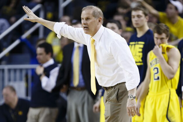 Feb 16, 2014; Ann Arbor, MI, USA; Michigan Wolverines head coach John Beilein reacts on the sidelines in the second half against the Wisconsin Badgers at Crisler Arena. The Badgers won 75-62. Mandatory Credit: Rick Osentoski-USA TODAY Sports