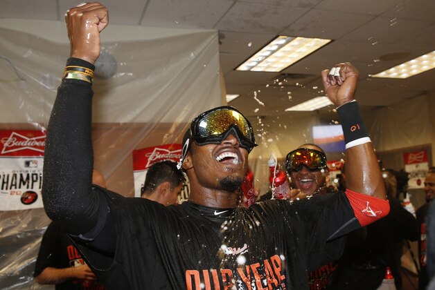 Baltimore Orioles center fielder Adam Jones celebrates after Baltimore defeated the Detroit Tigers, 2-1, in Game 3 of baseball's AL Division Series Sunday, Oct. 5, 2014, in Detroit. Baltimore won the series 3-0. (AP Photo/Paul Sancya)