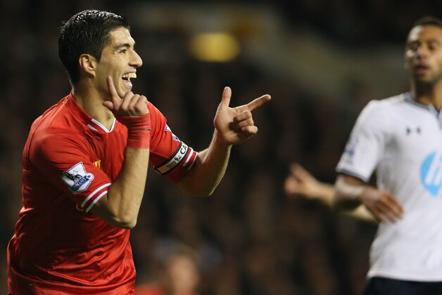 Liverpool's Luis Suarez celebrates after scoring a goal during the English Premier League soccer match between Tottenham Hotspur and Liverpool at the White Hart Lane stadium in London Sunday, Dec. 15, 2013. (AP Photo/Alastair Grant)