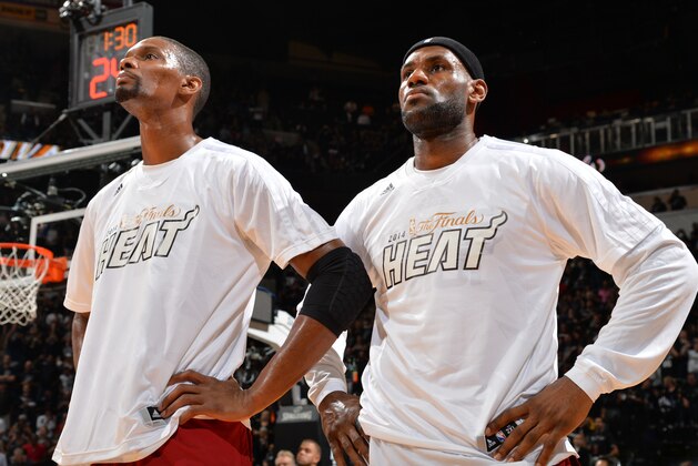 SAN ANTONIO, TX - JUNE 5: LeBron James #6 and Chris Bosh #1 of the Miami Heat looks on against the San Antonio Spurs during Game One of the 2014 NBA Finals on June 5, 2014 at AT&T Center in San Antonio, Texas. NOTE TO USER: User expressly acknowledges and agrees that, by downloading and or using this photograph, User is consenting to the terms and conditions of the Getty Images License Agreement. Mandatory Copyright Notice: Copyright 2014 NBAE (Photo by Jesse D. Garrabrant/NBAE via Getty Images)