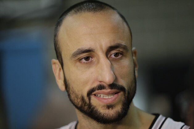 San Antonio Spurs' Manu Ginobili, of Argentina, talks to the media during an NBA basketball media day at the team's practice facility, Friday, Sept. 26, 2014, in San Antonio. (AP Photo/Eric Gay)