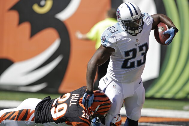 Tennessee Titans running back Shonn Greene (23) is tackled by Cincinnati Bengals cornerback Leon Hall (29) in the first half of an NFL football game, Sunday, Sept. 21, 2014, in Cincinnati. (AP Photo/Darron Cummings)