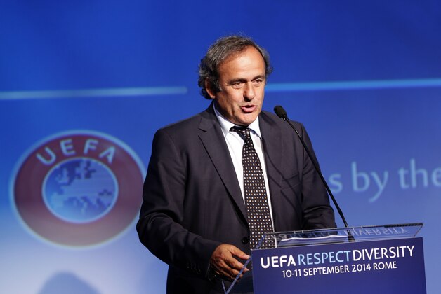UEFA President Michel Platini speaks during the opening session of UEFA's Respect and Diversity conference against discrimination in European soccer, in Rome, Wednesday, Sept. 10, 2014. Platini has promised a ruling from the organization's disciplinary body over an alleged racist comment by the Italian football federation's new leader. Carlo Tavecchio, a long-standing executive in Italian football, was elected president last month despite causing a stir over a reference to bananas when discussing the presence of foreign players in Italy. (AP Photo/Riccardo De Luca)