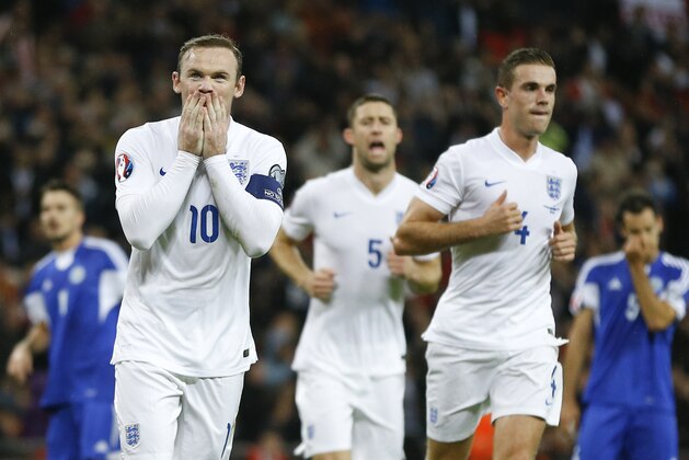 England's Wayne Rooney celebrates after he scores a goal during the Euro 2016 group E qualifying match between England and San Marino at Wembley stadium in London, Thursday, Oct. 9, 2014. (AP Photo/Kirsty Wigglesworth)