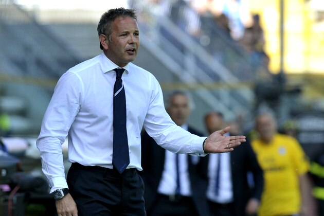 Sampdoria coach Sinisa Mihajlovic of Serbia follows a serie A soccer match between Parma and Sampdoria at Parma's Tardini stadium, Italy, Sunday, May 4, 2014. (AP Photo/Marco Vasini)