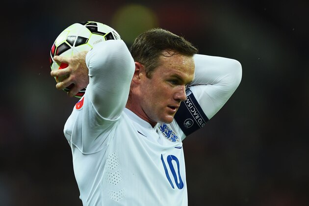LONDON, ENGLAND - OCTOBER 09:  Wayne Rooney of England takes a throw in during the EURO 2016 Group E Qualifying match between England and San Marino at Wembley Stadium on October 9, 2014 in London, England.  (Photo by Laurence Griffiths/Getty Images)