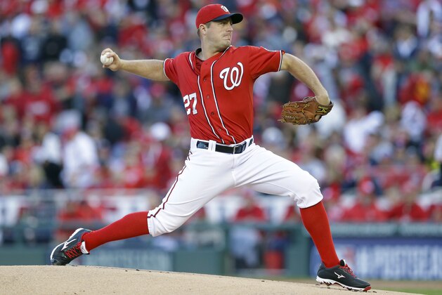FILE - In this Oct. 4, 2014 file photo, Washington Nationals starting pitcher Jordan Zimmermann (27) throws in the first inning in Game 2 of baseball's NL Division Series against the San Francisco Giants at Nationals Park in Washington. For the second time in three years, the Washington Nationals won the most games in the NL _ and then quickly exited the playoffs. Now comes an offseason of questions about manager Matt Williams' decisions and a handful of key roster choices, including what to do about Ryan Zimmerman, whether to sign Jordan Zimmermann and Ian Desmond to long-term deals, and how to upgrade an offense that fell flat in October. (AP Photo/Patrick Semansky, File)