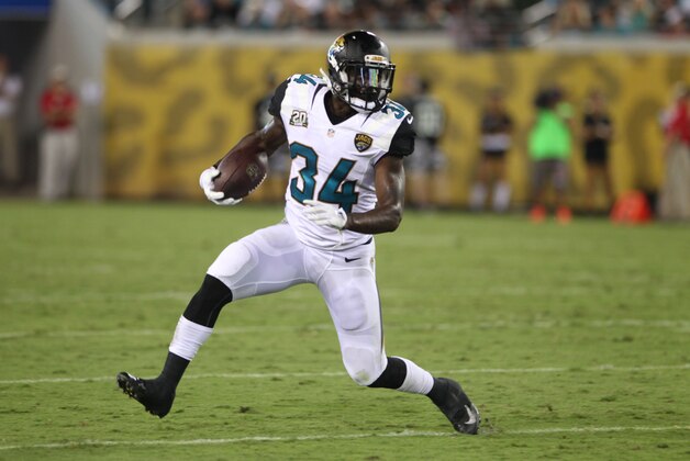 Running Back Storm Johnson #34 of the Jacksonville Jaguars runs the ball during a Pre-Season NFL football game against the Tampa Bay Buccaneers, Friday, Aug. 8, 2014, in Jacksonville, Fla. (Photo by Marc Serota/Panini/AP Images)