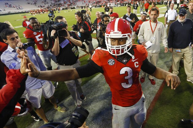 Georgia running back Todd Gurley (3) celebrates with fans after defeating Vanderbilt  44-17 in an NCAA college football game Saturday, Oct. 4, 2014, in Athens, Ga. (AP Photo/John Bazemore)
