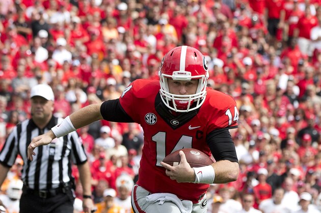 Georgia quarterback Hutson Mason (14) runs for a touchdown against Tennessee in the first half of an NCAA college football game  Saturday, Sept. 27, 2014, in Athens, Ga. (AP Photo/John Bazemore)