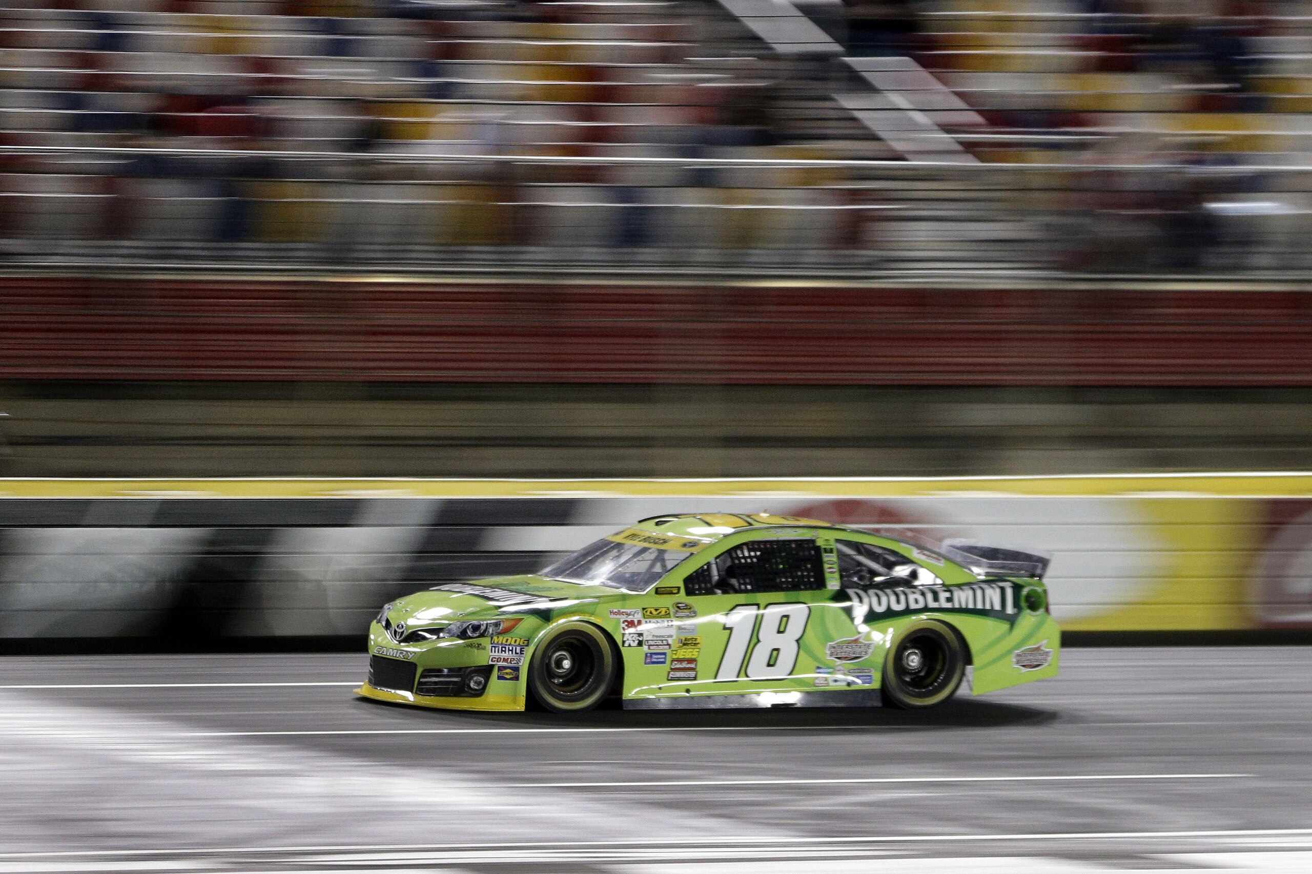 Kyle Busch drives his car qualifying for Saturday's NASCAR Bank of America Sprint Cup series auto race at Charlotte Motor Speedway in Concord, N.C., Thursday, Oct. 9, 2014. Busch won the pole position for the race with a lap of 197.390 mph. (AP Photo/Chuck Burton)