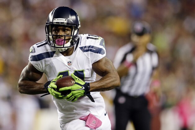 Seattle Seahawks wide receiver Percy Harvin (11) carries the ball during the first half of an NFL football game against the Washington Redskins in Landover, Md., Monday, Oct. 6, 2014. (AP Photo/Patrick Semansky)
