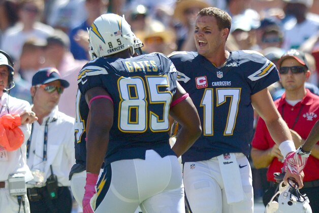 Oct 5, 2014; San Diego, CA, USA; San Diego Chargers quarterback Philip Rivers (17) celebrates a with tight end Antonio Gates (85) after throwing a touchdown pass to him during the first quarter against the New York Jets at Qualcomm Stadium. Mandatory Credit: Jake Roth-USA TODAY Sports
