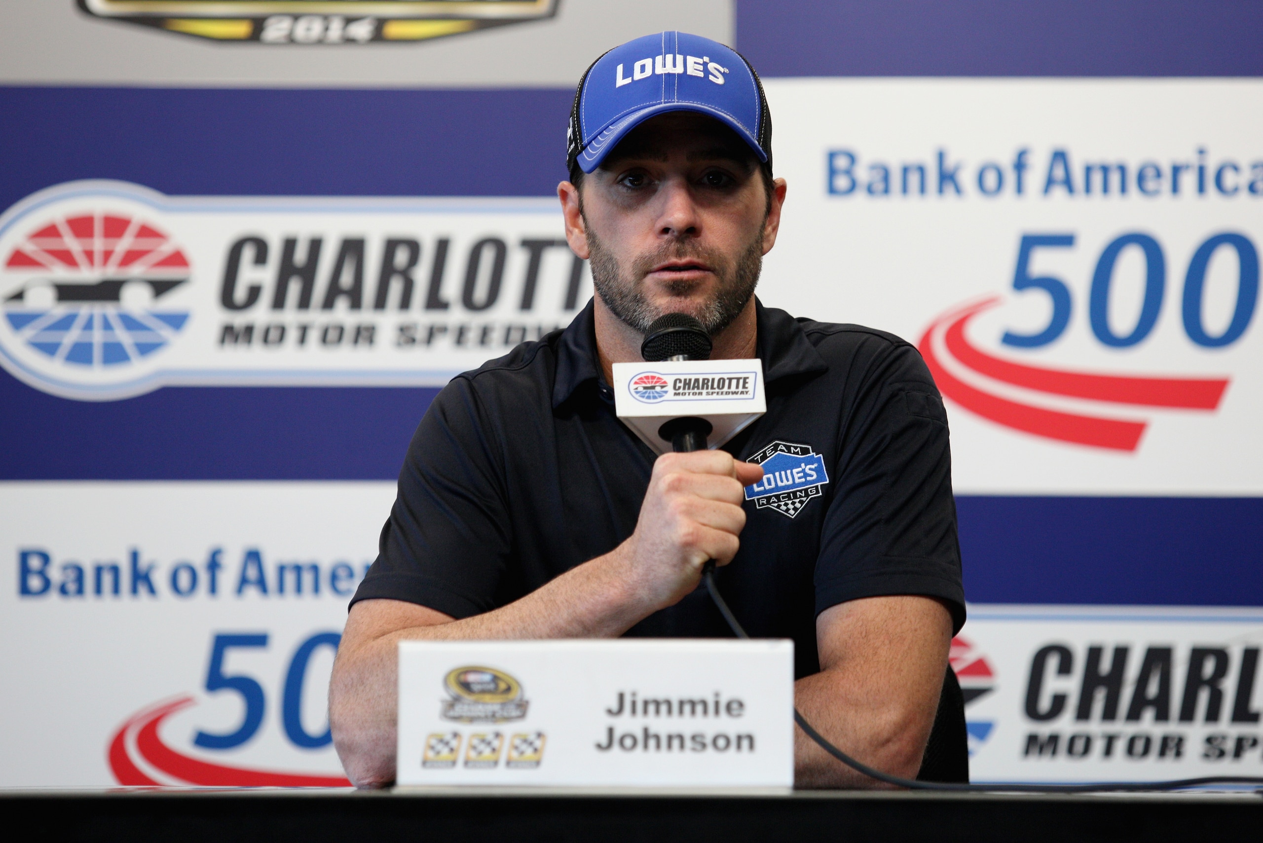 CHARLOTTE, NC - OCTOBER 09:  Jimmie Johnson, driver of the #48 Lowe's Chevrolet, speaks with the media during a press conference prior to practice for the NASCAR Sprint Cup Series Bank of America 500 at Charlotte Motor Speedway on October 9, 2014 in Charlotte, North Carolina.  (Photo by Tim Bradbury/Getty Images)