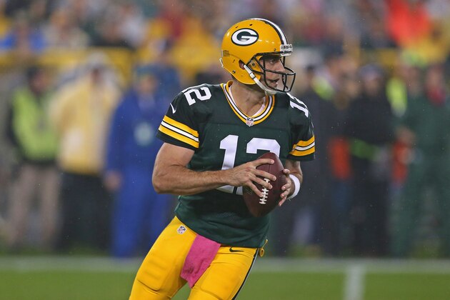 GREEN BAY, WI - OCTOBER 02:  Aaron Rodgers #12 of the Green Bay Packers looks for a receiver against the Minnesota Vikings at Lambeau Field on October 2, 2014 in Green Bay, Wisconsin. The Packers defeated the Vikings 42-10.  (Photo by Jonathan Daniel/Getty Images)