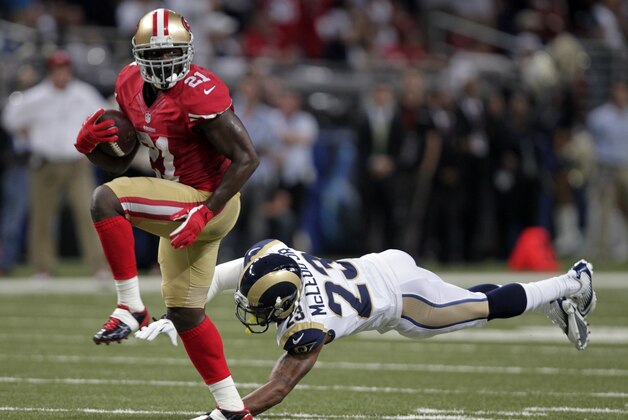 San Francisco 49ers running back Frank Gore, left, runs past St. Louis Rams safety Rodney McLeod on his way to a 34-yard touchdown during the second quarter of an NFL football game Thursday, Sept. 26, 2013, in St. Louis. (AP Photo/Tom Gannam) San Francisco 49ers running back Frank Gore, left, runs past St. Louis Rams safety Rodney McLeod on his way to a 34-yard touchdown during the second quarter of an NFL football game Thursday, Sept. 26, 2013, in St. Louis. (AP Photo/Tom Gannam)