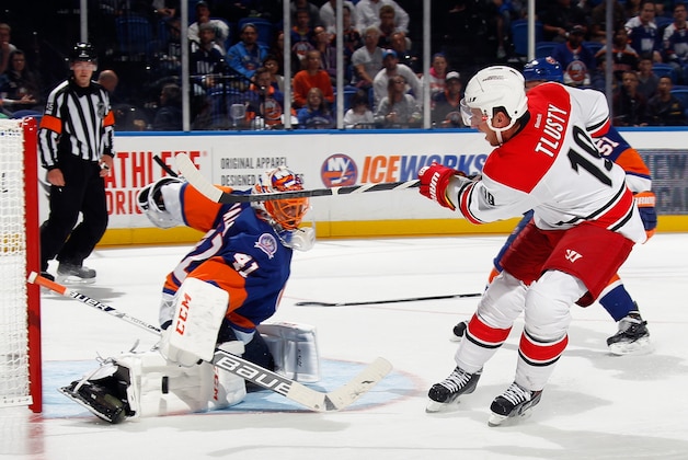 UNIONDALE, NY - SEPTEMBER 24: Jaroslav Halak #41 of the New York Islanders makes the third period save on Jiri Tlusty #19 of the Carolina Hurricanes at the Nassau Veterans Memorial Coliseum on September 24, 2014 in Uniondale, New York.  The Hurricanes defeated the Islanders 4-2. (Photo by Bruce Bennett/Getty Images)