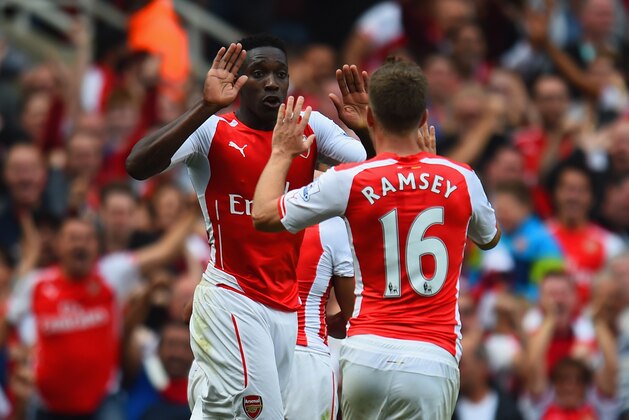 LONDON, ENGLAND - SEPTEMBER 13:  Danny Welbeck and Aaron Ramsey of Arsenal celebrate after Jack Wilshere of Arsenal (not pictured) scores their first goal during the Barclays Premier League match between Arsenal and Manchester City at Emirates Stadium on September 13, 2014 in London, England.  (Photo by Shaun Botterill/Getty Images)