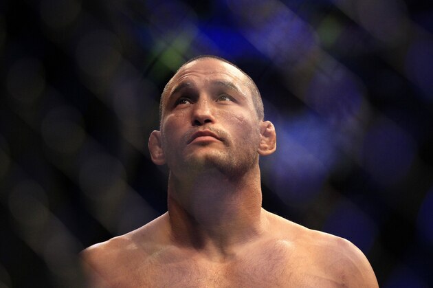 Dan Henderson, center, is shown before a UFC 139 Mixed Martial Arts light heavyweight bout against Mauricio Rua in San Jose, Calif., Saturday, Nov. 19, 2011. (AP Photo/Jeff Chiu)