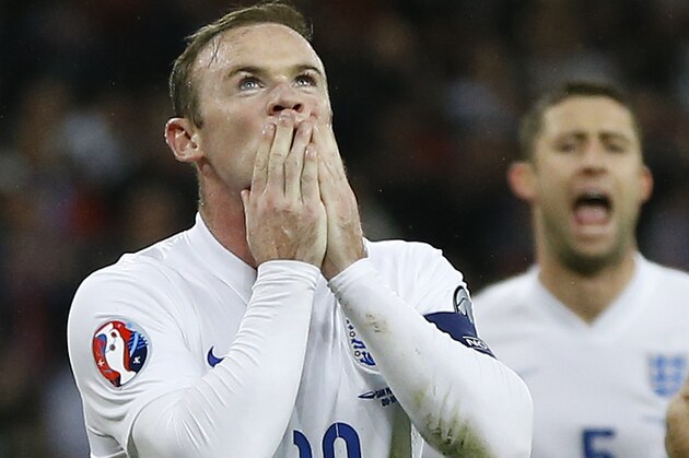 England's Wayne Rooney, left, celebrates after he scores a goal  during the Euro 2016 group E qualifying match between England and San Marino at Wembley stadium in London, Thursday, Oct. 9, 2014. (AP Photo/Kirsty Wigglesworth)