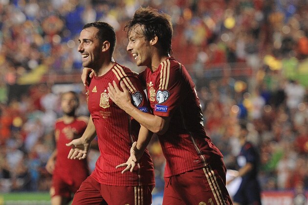 VALENCIA, SPAIN - SEPTEMBER 08:  Paco Alcacer celebrates with David Silva after scoring Spain's 2nd goal during the UEFA EURO 2016 Group C Qualifier between Spain and FYR of Macedonia at Estadio Ciutat de Valencia on September 8, 2014 in Valencia, Spain.  (Photo by Denis Doyle/Getty Images)