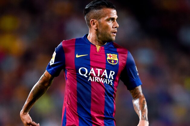 BARCELONA, SPAIN - AUGUST 18:  Dani Alves of FC Barcelona runs with the ball during the Joan Gamper Trophy match between FC Barcelona and Club Leon at Camp Nou on August 18, 2014 in Barcelona, Spain.  (Photo by David Ramos/Getty Images)
