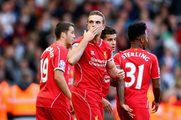 LIVERPOOL, ENGLAND - OCTOBER 04:  Jordan Henderson of Liverpool blows a kiss to the crowd as he celebrates scoring their second goal  during the Barclays Premier League match between Liverpool and West Bromwich Albion at Anfield on October 4, 2014 in Liverpool, England.  (Photo by Clive Brunskill/Getty Images)