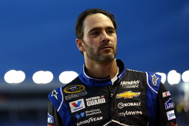 CHARLOTTE, NC - OCTOBER 09:  Jimmie Johnson, driver of the #48 Lowe's Chevrolet, looks on from the grid prior to qualifying for the NASCAR Sprint Cup Series Bank of America 500 at Charlotte Motor Speedway on October 9, 2014 in Charlotte, North Carolina.  (Photo by Streeter Lecka/Getty Images)