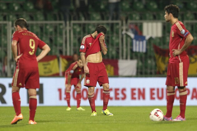 Spain's Diego Costa, right, Cesc Fabregas, center, and Paco Alcacer, left, react during the Group C Euro 2016 qualifying match between Slovakia and Spain in Zilina, Slovakia, Thursday, Oct. 9, 2014. (AP Photo/Petr David Josek)