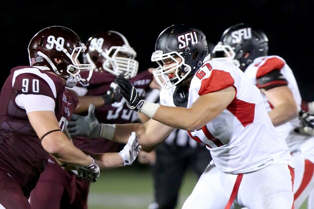 St, Francis (PA) Red Flash Thurston Kino #67 in action against the Fordham Rams during a college football game on Saturday, August 30, 2014 in the Bronx, NY.  Fordham won the game 53-22.  (AP Photo/Gregory Payan)