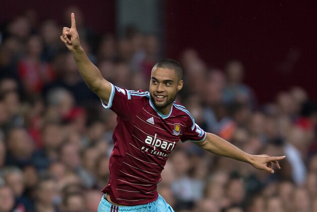 West Ham United’s Winston Reid celebrates scoring his team's first goal during their English Premier League soccer match against Liverpool at Upton Park, London, Saturday, Sept. 20, 2014. (AP Photo/Tim Ireland)