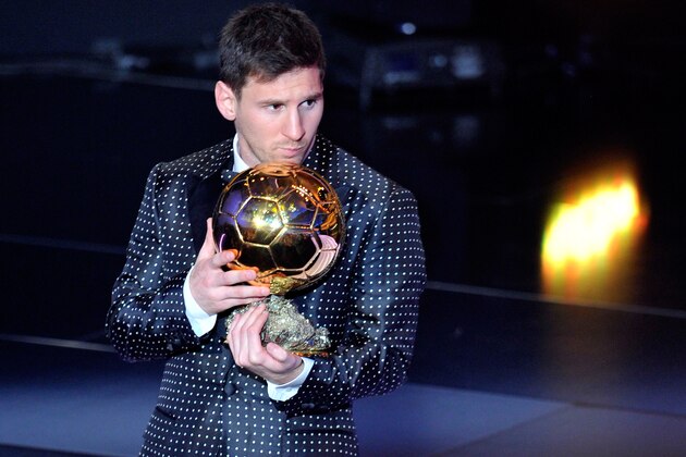 ZURICH, SWITZERLAND - JANUARY 07:  Lionel Messi of Argentina holds the trophy after winning the FIFA Ballon d'Or for a fourth consecutive time during the FIFA Ballon d'Or Gala 2013 at Congress House on January 7, 2013 in Zurich, Switzerland.  (Photo by Harold Cunningham/Getty Images)