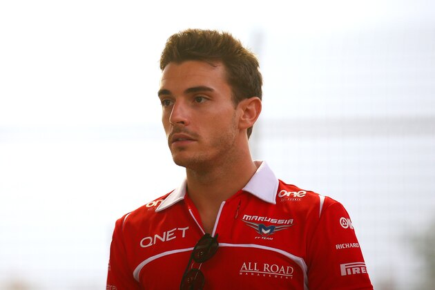 SINGAPORE - SEPTEMBER 21:  Jules Bianchi of France and Marussia arrives for the drivers' parade before the Singapore Formula One Grand Prix at Marina Bay Street Circuit on September 21, 2014 in Singapore, Singapore.  (Photo by Mark Thompson/Getty Images)