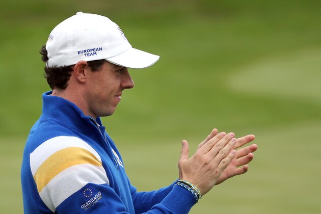 Europe’s Rory McIlroy applauds on the 17th green after Graeme McDowell wins the singles match against Jordan Spieth of the US on the final day of the Ryder Cup golf tournament, at Gleneagles, Scotland, Sunday, Sept. 28, 2014. (AP Photo/Scott Heppell)