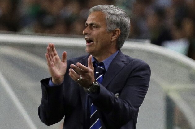 Chelsea's head coach Jose Mourinho shouts as he watches a Champions League, Group G soccer match between Sporting and Chelsea, in Lisbon, Tuesday, Sept. 30, 2014. (AP Photo/Francisco Seco)