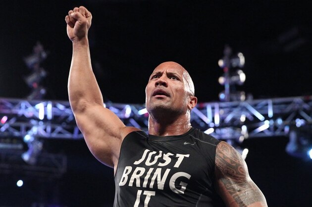 Dwayne Johnson aka The Rock reacts during Wrestlemania XXX at the Mercedes-Benz Super Dome in New Orleans on Sunday, April 6, 2014. (Jonathan Bachman/AP Images for WWE)