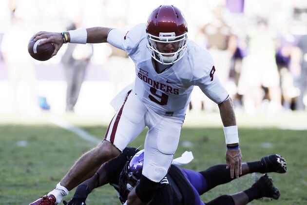 Oklahoma quarterback Trevor Knight (9) escapes from TCU linebacker Paul Dawson (47) during the second half of a NCAA college football game at Amon G. Carter Stadium, Saturday, Oct. 4, 2014, in Fort Worth, Texas. TCU won 37-33. (AP Photo/Brandon Wade)