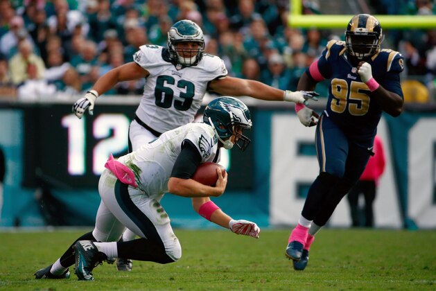 Philadelphia Eagles' Nick Foles slides and fumbles the ball during the second half of an NFL football game against the St. Louis Rams, Sunday, Oct. 5, 2014, in Philadelphia. (AP Photo/Matt Rourke)
