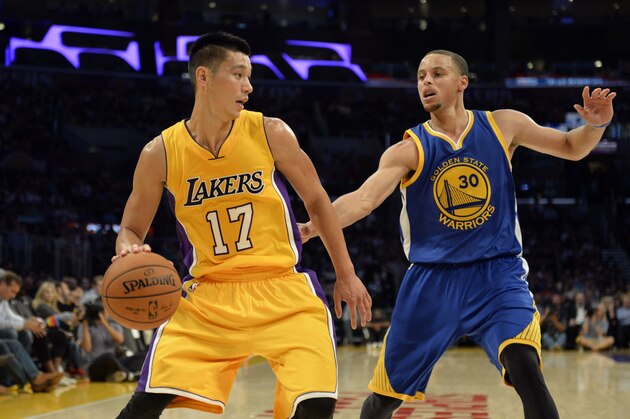 Oct 9, 2014; Los Angeles, CA, USA; Los Angeles Lakers guard Jeremy Lin (17) drives against Golden State Warriors guard Stephen Curry (30) during the second half at Staples Center. Mandatory Credit: Richard Mackson-USA TODAY Sports