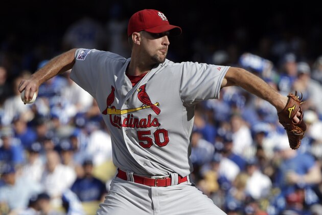 St. Louis Cardinals starting pitcher Adam Wainwright throws against the Los Angeles Dodgers during the second inning in Game 1 of baseball's NL Division Series in Los Angeles, Friday, Oct. 3, 2014. (AP Photo/Alex Gallardo)